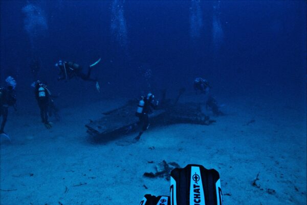 Scuba Divers Swimming Underwater